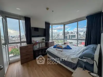 Stunning bedroom with panoramic city views and modern decor