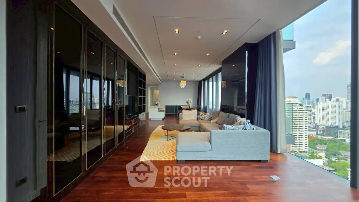 Luxurious corner unit living room with panoramic city views and elegant modern furnishings.