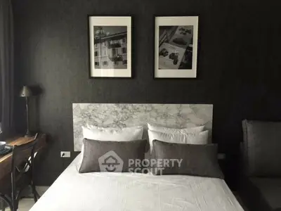 Stylish bedroom with modern decor and elegant wall art