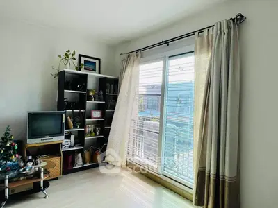 Bright living room with large window and stylish decor