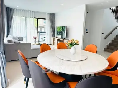 Modern living room with elegant dining area and stylish decor