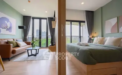 Modern apartment with stylish living room and cozy bedroom, featuring large windows and a balcony view.
