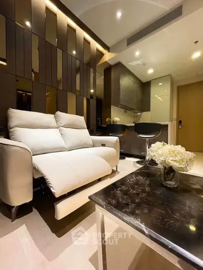 Luxurious modern living room with sleek furniture and elegant decor in a stylish apartment.