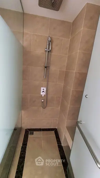 Modern bathroom with sleek shower design and elegant tile work