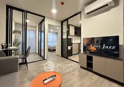Modern living room with stylish decor and open layout in a cozy apartment.