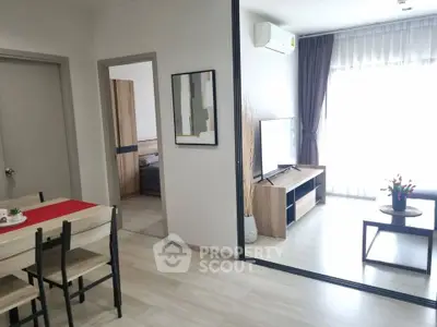 Modern living room with natural light, stylish decor, and open layout in a contemporary apartment.