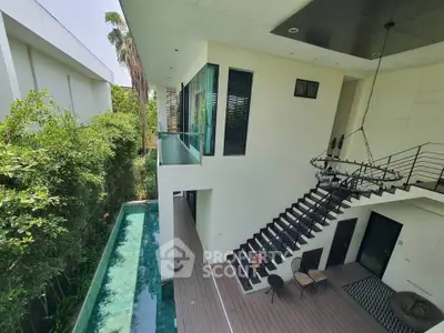 Modern architectural home with sleek design, pool, and lush greenery, offering luxury and tranquility.