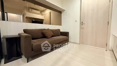 Modern living room with brown sofa and minimalist decor