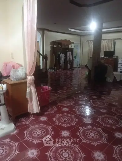 Spacious living room with glossy patterned floor tiles and elegant furnishings.