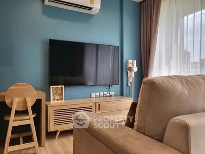 Modern living room with sleek TV setup and stylish wooden furniture