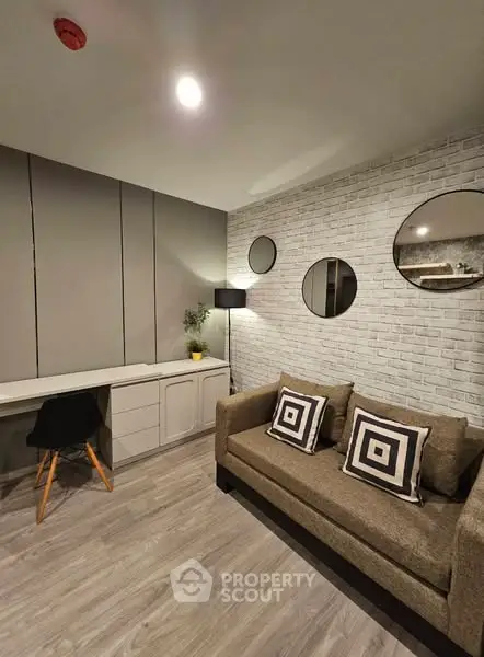 Modern living room with stylish decor and cozy seating area.