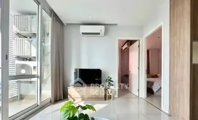 Modern living room with sleek design, large windows, and air conditioning unit, perfect for urban living.