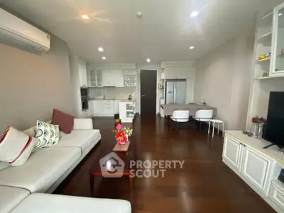 Spacious modern living room with open kitchen and elegant decor