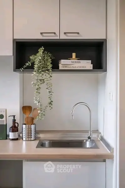 Modern kitchen with sleek cabinetry and stylish faucet, perfect for contemporary living.