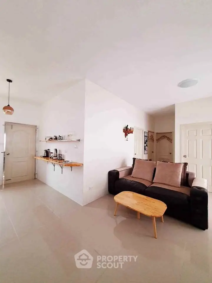 Modern living room with cozy sofa and minimalist decor