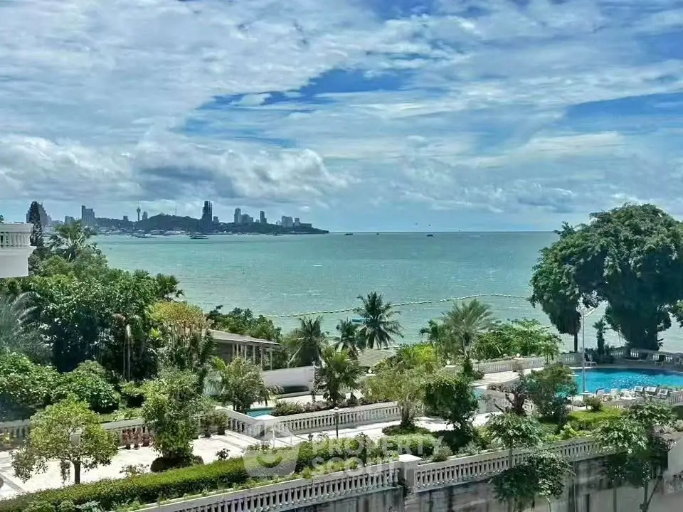 Stunning ocean view from luxury property with lush gardens and pool, perfect for serene living.