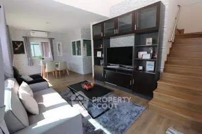 Stylish living room with modern furniture and entertainment center