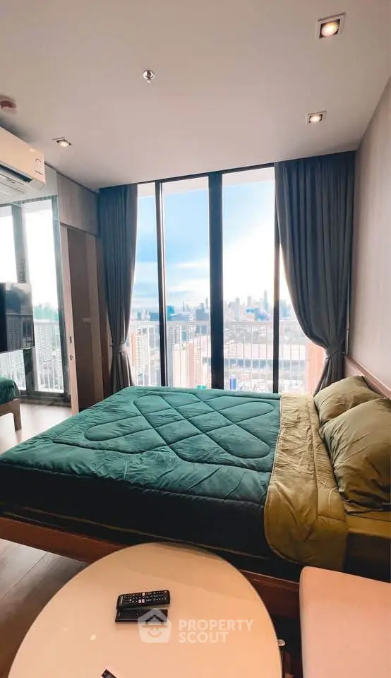 Luxurious bedroom with stunning city view and modern decor