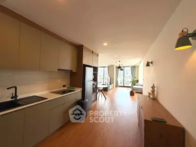 Spacious open-plan kitchen and living area with modern design and natural light.