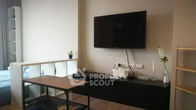 Modern living room with wall-mounted TV and stylish decor