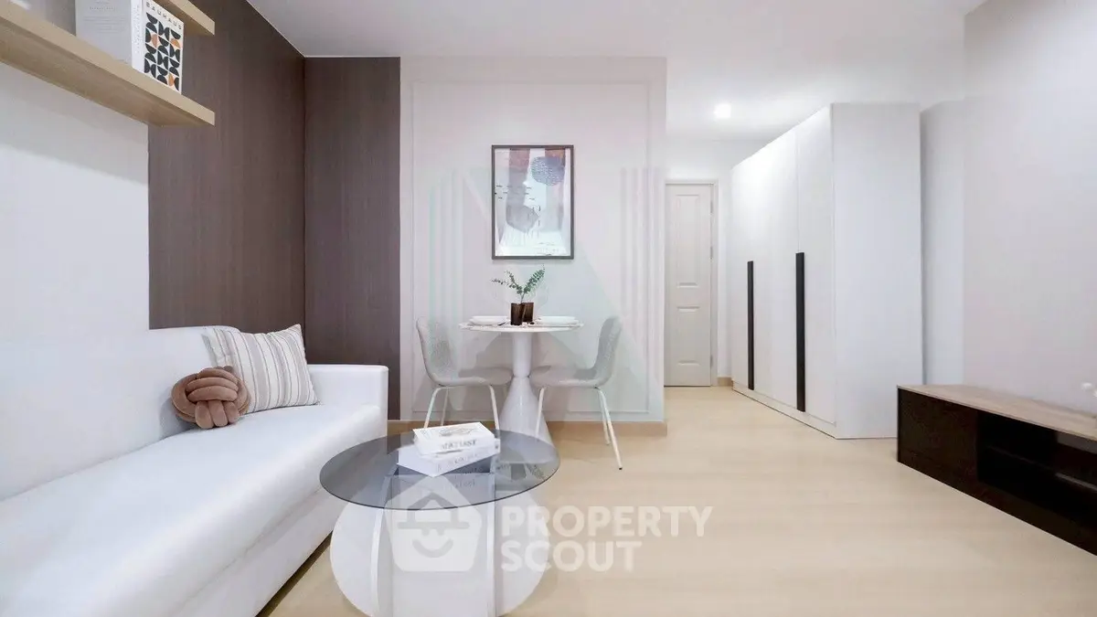 Modern living room with sleek furniture and stylish decor in a contemporary apartment.
