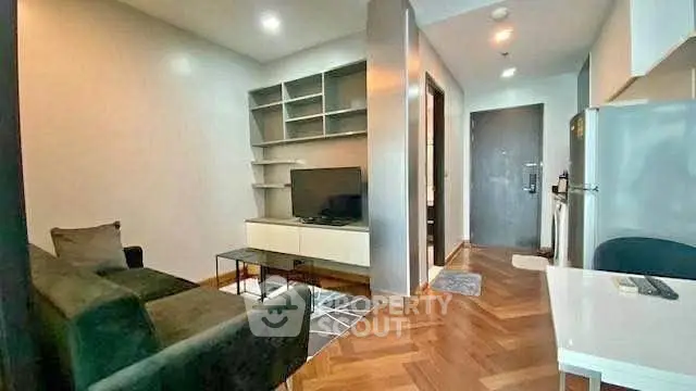 Modern living room with sleek furniture and open layout in a stylish apartment.