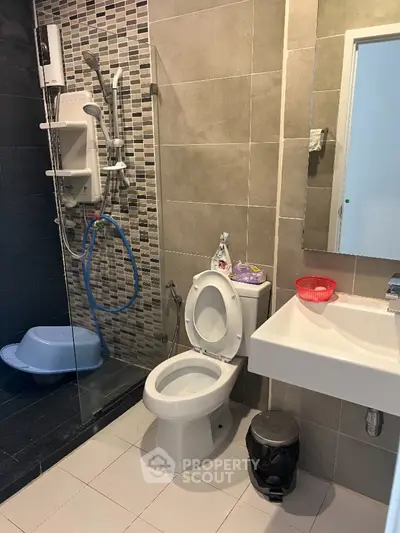 Modern bathroom with glass shower and sleek tile design