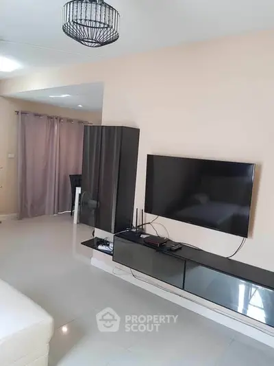 Modern living room with sleek TV setup and elegant decor