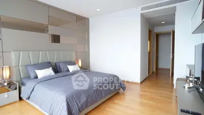 Luxurious modern bedroom with stylish decor and ample natural light