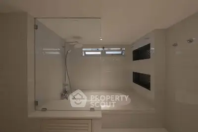 Modern bathroom with sleek design and built-in bathtub