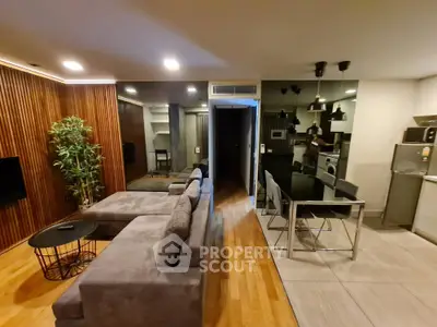 Modern open-plan living room with stylish kitchen and cozy seating area