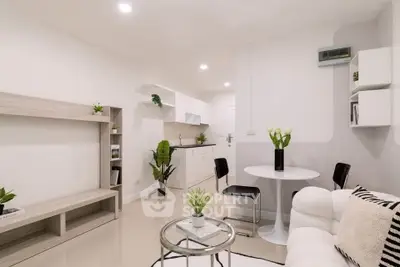 Modern open-plan living room with stylish decor and cozy seating area