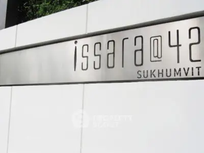 Modern building sign for Issara@42 Sukhumvit, showcasing sleek architectural design.