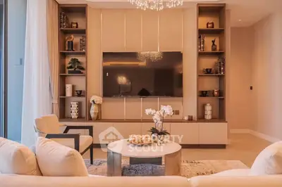 Luxurious living room with elegant decor and modern entertainment center