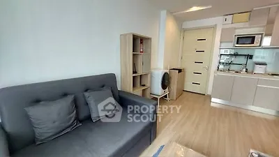Modern living room with sleek kitchen in open layout apartment