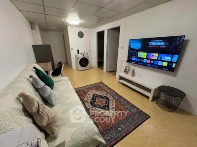 Cozy living room with modern TV setup and stylish decor