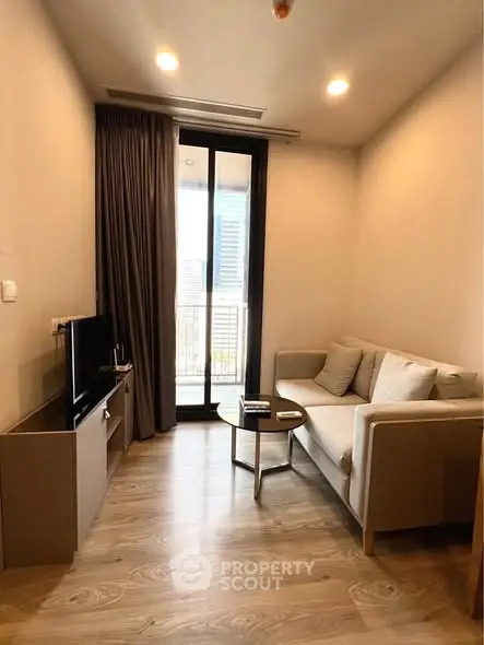 Modern living room with cozy sofa and city view balcony