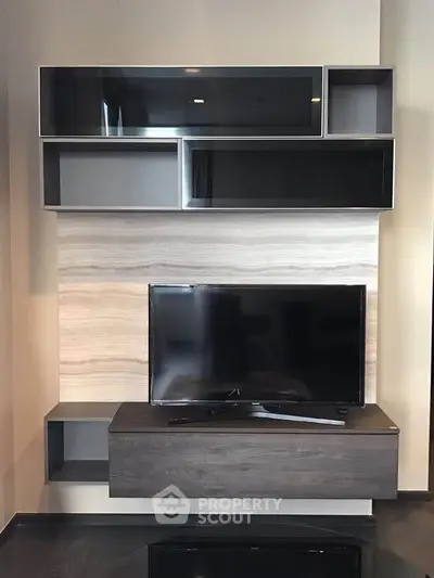 Modern living room with sleek TV unit and stylish shelving