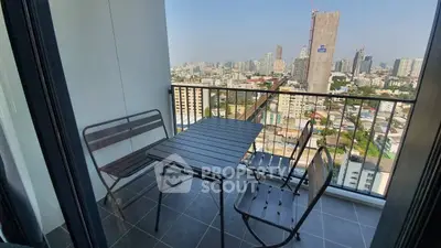 Modern balcony with city view, featuring sleek outdoor furniture and panoramic skyline.