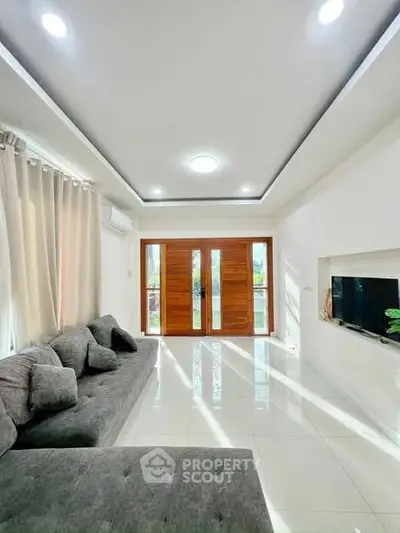 Spacious modern living room with elegant decor and natural light