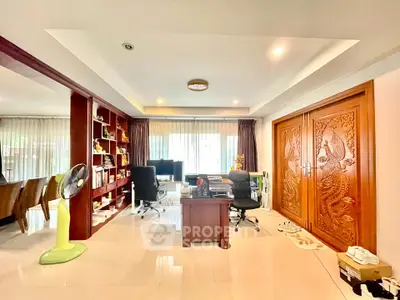 Spacious living room with elegant wooden decor and ample natural light