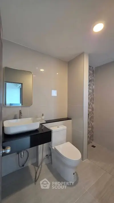 Modern bathroom with sleek fixtures and elegant tile design