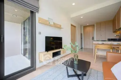 Modern living room with sleek furniture and open kitchen layout