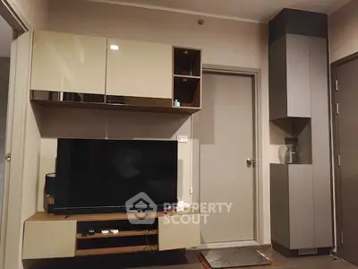 Modern living room with sleek TV unit and stylish storage cabinets