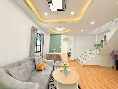 Stylish living room with modern ceiling design and cozy furniture