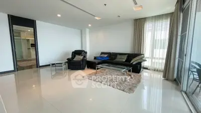 Spacious modern living room with sleek furniture and large windows