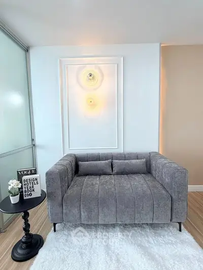 Modern living room with stylish gray sofa and elegant decor