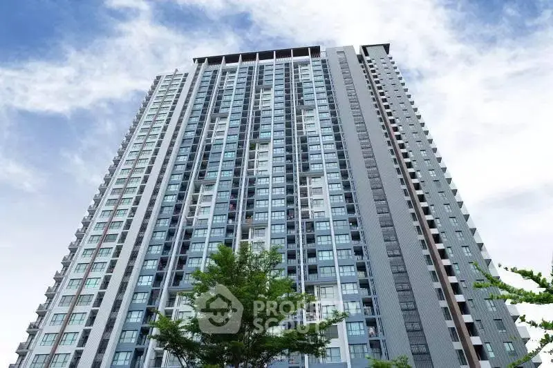 Stunning high-rise building with modern architecture against a clear blue sky.