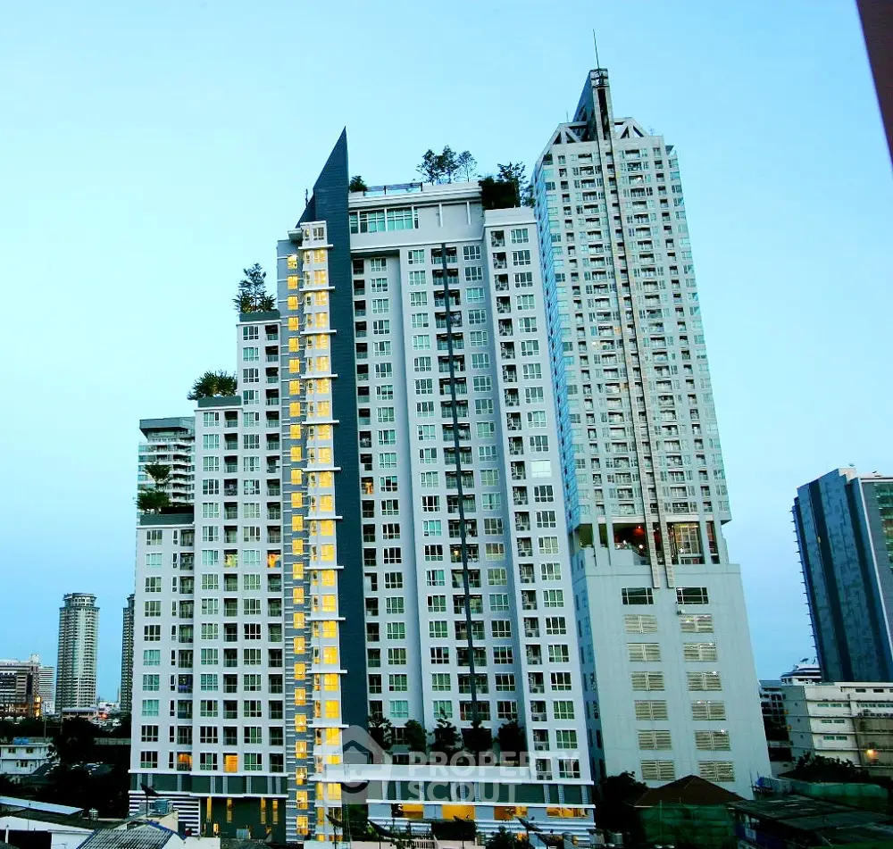 Stunning high-rise residential building with modern architecture and lush rooftop gardens in urban skyline.