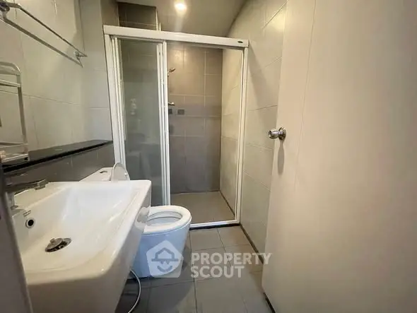 Modern bathroom with sleek shower and contemporary fixtures